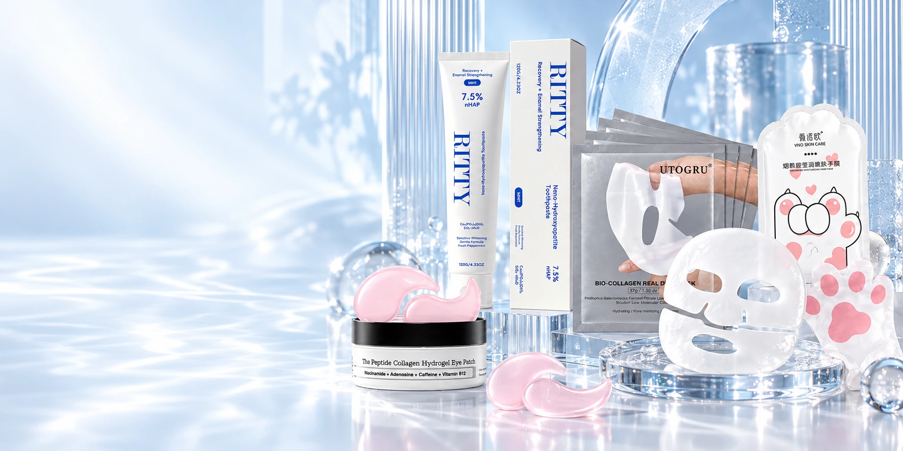 Yihua toothpaste, hydrogel face and eye masks, and cat-paw hand mask staged on luminous blue glass